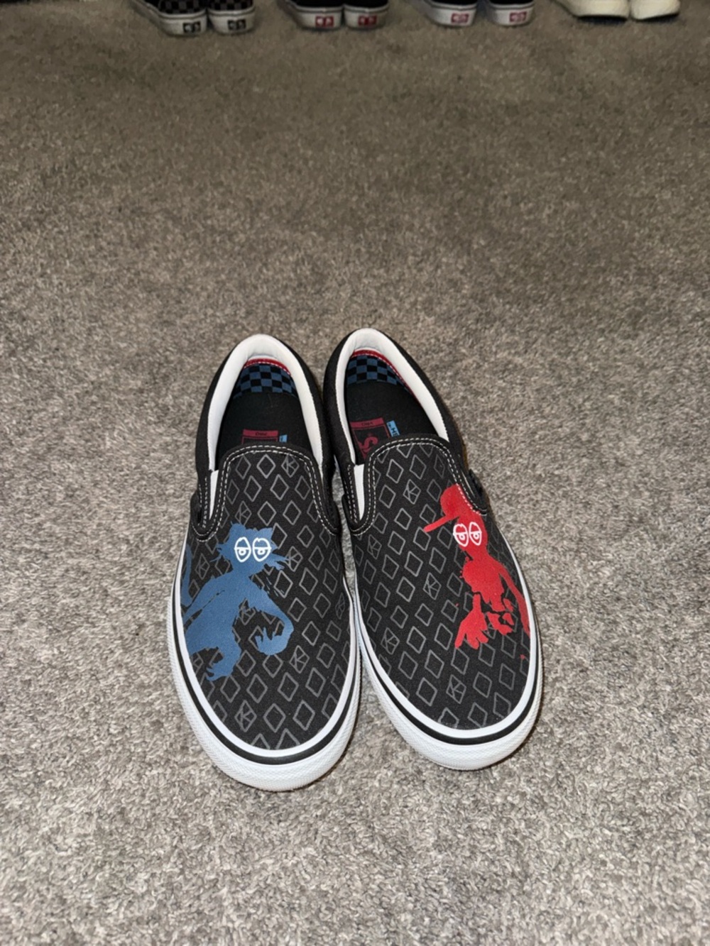 Vans Slip-On Sneakers with Red & Blue Character Graphics